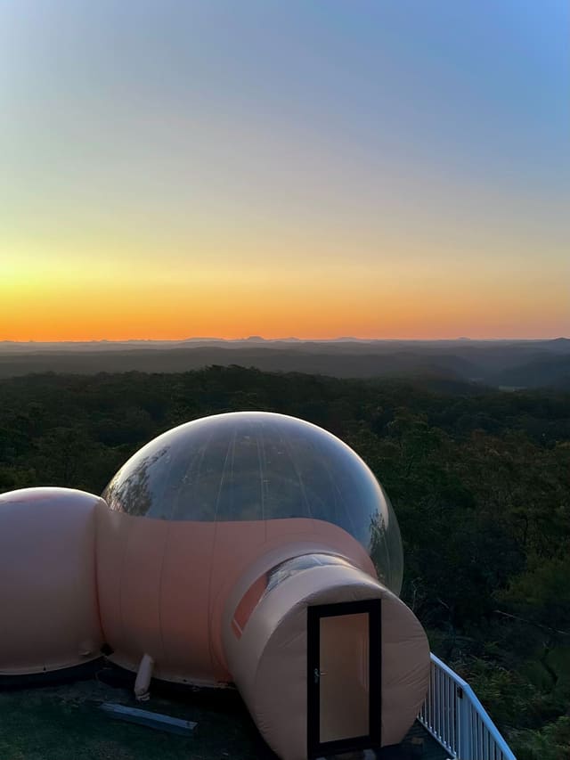 Sunset over ridgelines behind the bubble dome at Beyond Bubbles, Bucketty.